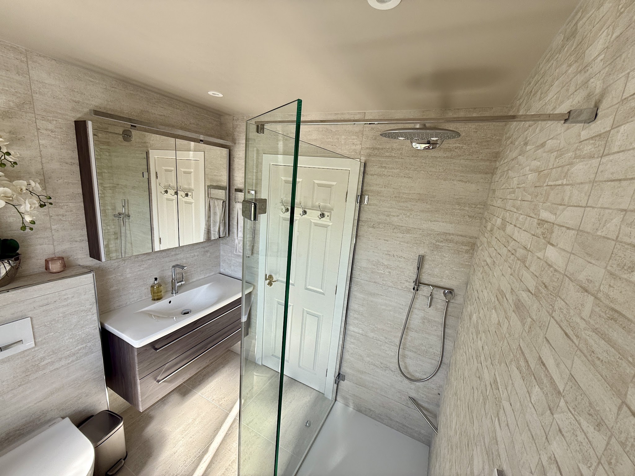 Mirror cabinet, vanity and shower enclosure in Nic Knight's bathroom